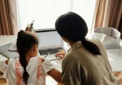 Adult and child using computer