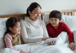 mom and kids with tablet